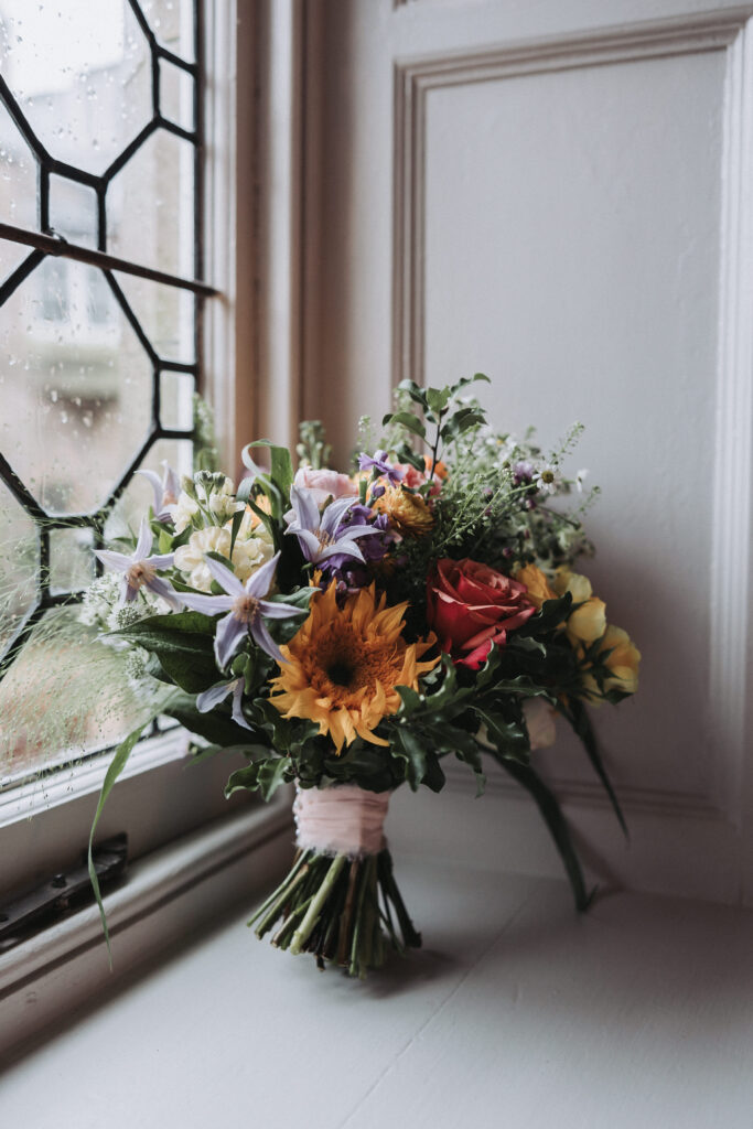 Bridal bouquet on a windowsill - florals by bluebells and daisies